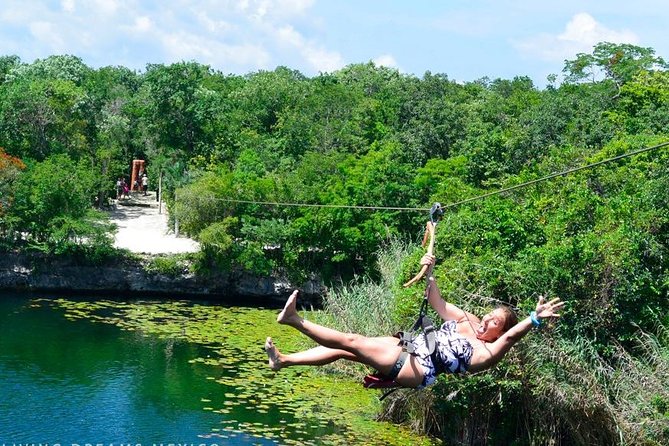 4 Private Cenotes, Zip-Lines, Canoes & Mayan Village with Delicious Lunch - Zip-lines above the Tankah jungle