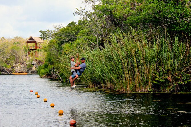 4 Private Cenotes, Zip-Lines, Canoes & Mayan Village with Delicious Lunch - Canoes, snorkeling, and clear underground water