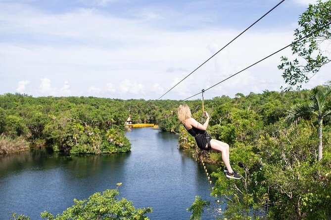 Cenotes trail jungle bike tour in Tulum with lunch - Three cenotes, zip lines, and a canoe