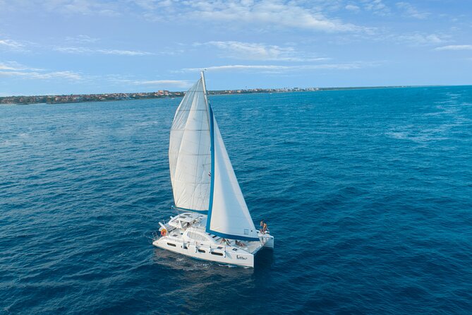 Half-Day Luxury Sailing Experience in Tulum with Open Bar - Boarding the catamaran in Puerto Aventuras