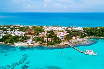 Isla Mujeres on luxury catamaran with snorkel, open bar and lunch