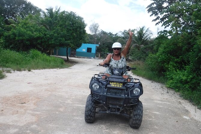 Private ATV Jungle & Cave Adventure - Riding an ATV through dusty jungle roads