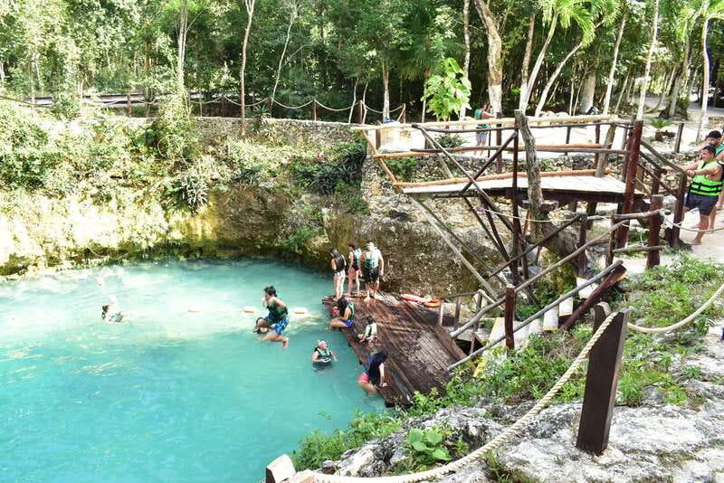 Rider Tour - Cooling off in the open cenote